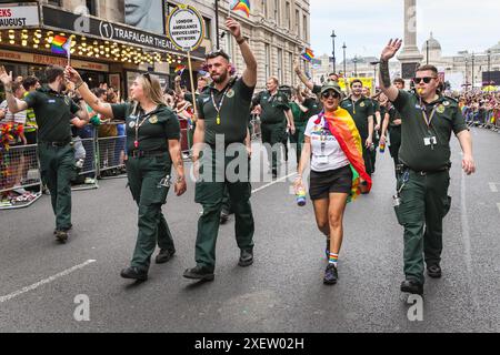 London, UK. 29th June, 2024. The London Ambulance Service staff march in the parade. Participants and spectators have fun along the route at the Pride in London 2024 Parade. The parade progresses from Hype Park along Piccadilly to Whitehall, and a party in Trafalgar Square. It celebrates diversity and the LGBT  community. Credit: Imageplotter/Alamy Live News Stock Photo