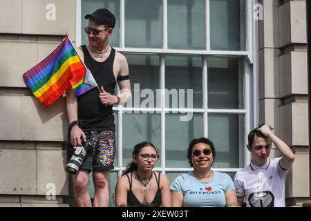 London, UK. 29th June, 2024. Revellers in Whitehall. Participants and spectators have fun along the route at the Pride in London 2024 Parade. The parade progresses from Hype Park along Piccadilly to Whitehall, and a party in Trafalgar Square. It celebrates diversity and the LGBT  community. Credit: Imageplotter/Alamy Live News Stock Photo