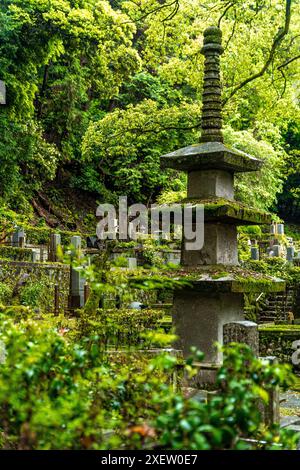 A stone pagoda in the graveyard of Honen-in Buddhist temple, near the Philosopher's path, Kyoto, Japan. Stock Photo