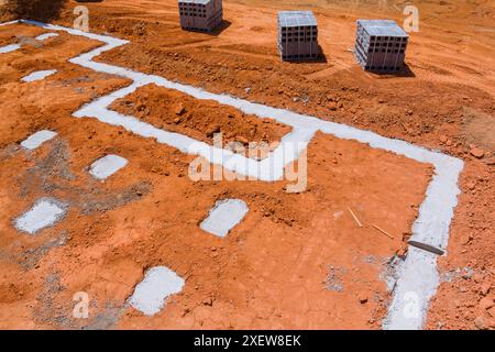 Cement blocks delivered to construction site with foundation is ready for mounting wall Stock Photo