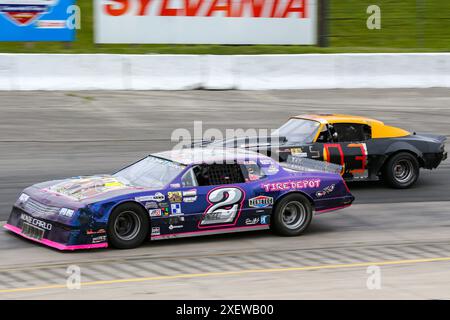 Delaware, Canada. 28th June, 2024. The APC Series comes to Delaware Ontario. Hot Rods Series Driver Tyler Hawn(2) and  Steve Ecker(3) battles for position. Credit: Luke Durda/Alamy Stock Photo