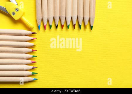 Pencils and compass on yellow background, closeup Stock Photo