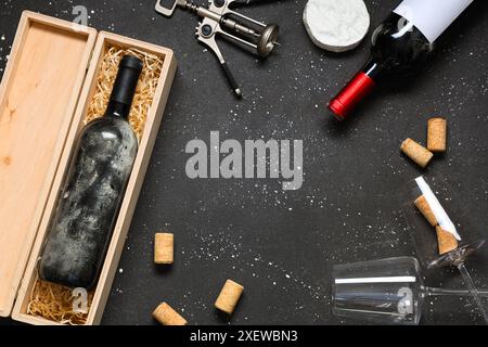 Frame made from bottles of wine, corks and opener on black grunge background Stock Photo
