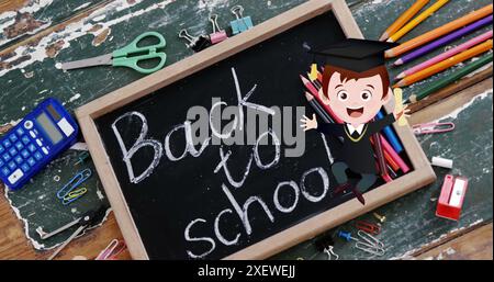 Image of excited schoolboy and books moving over chalkboard with back to school text on desk Stock Photo