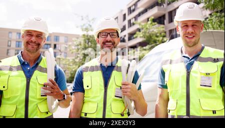 Mobile Vehicle Maintenance: Smiling Technicians Providing Professional Services Outdoors in Front of Delivery Van for Happy Customers Stock Photo