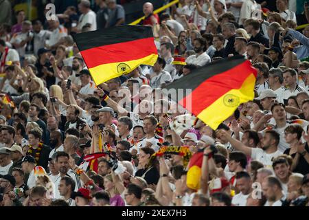 Dortmund, Germany. 29th June, 2024. Fans of Germany cheer for the team during the UEFA Euro 2024 Round of 16 match between Germany and Denmark in Dortmund, Germany, June 29, 2024. Credit: Xiao Yijiu/Xinhua/Alamy Live News Stock Photo