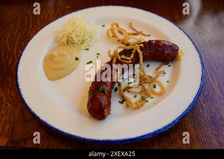 Klobasa or Kielbasa Smoked Sausage with Mustard and Horseradish Stock Photo