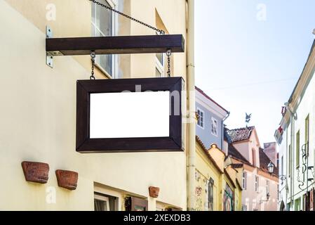 Blank Mockup Of Restaurant Wooden Vintage Street Sign Board In European Old Town Stock Photo