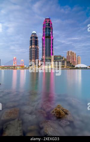 UDC twin tower Pearl Qatar view with gewan bridge Stock Photo - Alamy
