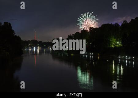 Turin fireworks reflecting on the river Po with Mole Antonelliana in the background. Stock Photo