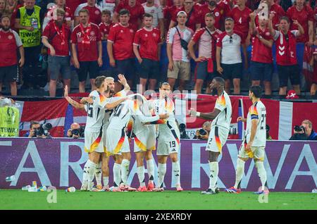 Kai Havertz, DFB 7 celebrates his goal, happy, laugh, celebration, 1-0, Antonio Rüdiger, Ruediger, DFB 2 Nico Schlotterbeck, DFB 15  in the best of 16 match GERMANY  - DENMARK 2-0 of the UEFA European Championships 2024  on Jun 29, 2024  in Dormund, Germany.  Photographer: ddp images / star-images Stock Photo