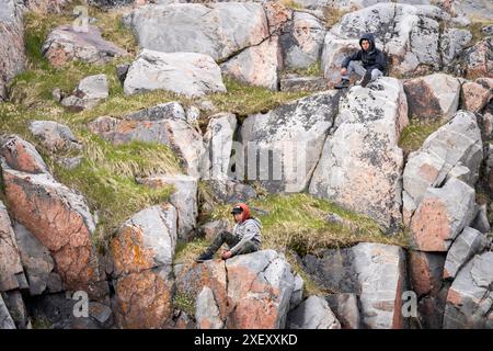 Aasiaat, Groenland. 29th June, 2024. Residents watch as King Frederik X unveils a memorial plaque upon arrival to Aasiaat in Greenland, Saturday the 29th of June 2024. The plaque commemorates a tragic capsizing of a woman's boat in 1924 and two hunters' act of rescue in this context. The royal couple officially visits Greenland from the 29th of June to the 6th of July 2024. The visit begins in Disko Bay and the royal couple then travels with Dannebrog south along Greenland's west coast. (Photo: Ida Marie Odgaard/Ritzau Scanpix) Credit: Ritzau/Alamy Live News Stock Photo