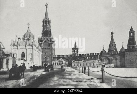 19th century photo of Ascension Convent (Starodevichy Convent) and Spassky gate. Russian Empire. Ascension Convent, known as the Starodevichy Convent or Old Maidens' Convent until 1817, was an Orthodox nunnery in the Moscow Kremlin which contained the burials of grand princesses, tsarinas, and other noble ladies from the Muscovite royal court.  The Spasskaya Tower, translated as 'Saviour Tower', is the main tower on the eastern wall of the Moscow Kremlin which overlooks Red Square. Stock Photo