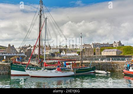 Portsoy Boat Festival boats in the harbour the Swan from Lerwick and the Raasay Stock Photo