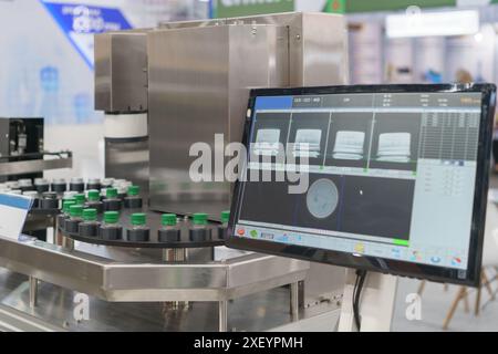 automated bottle inspection system, designed to ensure the quality and integrity of bottled products in a production line Stock Photo
