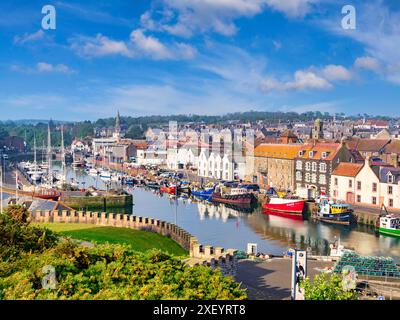 15 May 2024: Eyemouth, Scotland, UK - The town and riverside harbour on a bright spring day Stock Photo