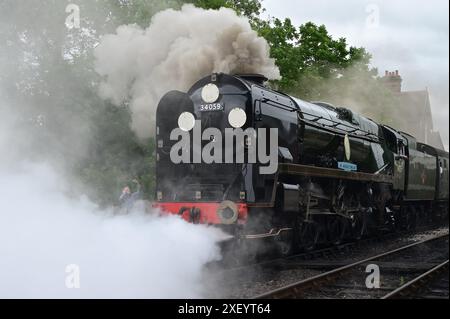 Sir Archibald Sinclair a Battle of Britain Class steam locomotive smoking at Sheffield Park station on The Bluebell Railway. Stock Photo