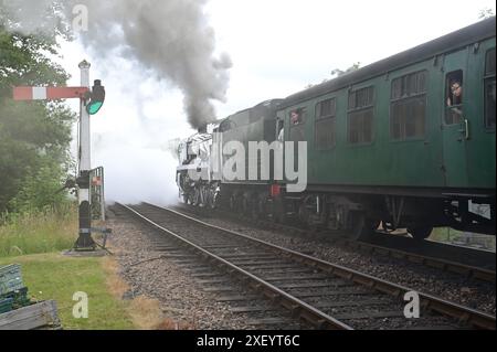 Sir Archibald Sinclair a rebuilt Battle of Britain class locomotive pulling a passenger train out of Sheffield Park station. Stock Photo