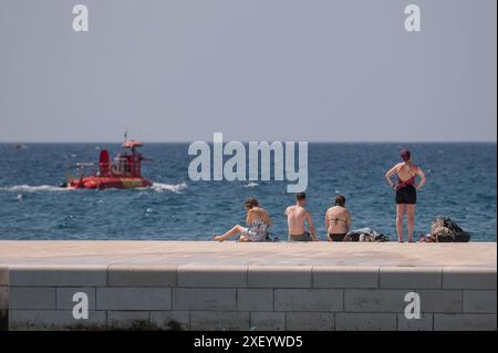 Zadar, Croatia. 30th June, 2024. People enjoy sunny day at Zadar ...