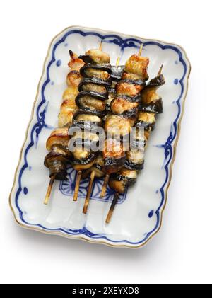 Kurikara-yaki (charcoal grilled eel skewers), Japanese unagi dish isolated on white background Stock Photo