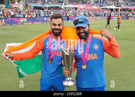 India’s Rohit Sharma (R) and Virat Kohli after winning the 2024 ICC Men's T20 World Cup final at the Kensington Oval Barbados in Bridgetown, Barbados. Picture date: Saturday June 29, 2024. Stock Photo