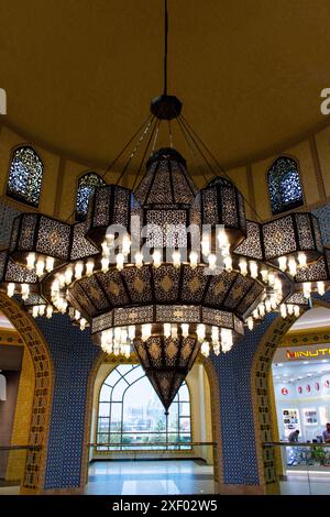 Beautiful oriental chandelier hanging from the ceiling of Ibn Battuta shopping mall in Dubai. Stock Photo