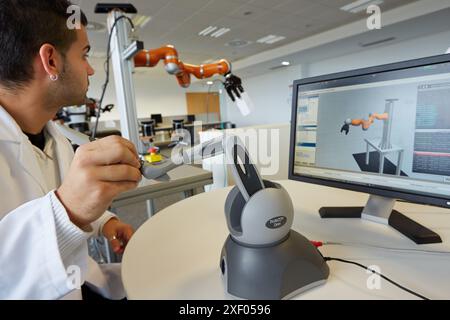 LWR robot, using haptic teleoperation with force feedback  Safety in human-robot cooperation  Industry, Tecnalia Research & innovation, Technology and Stock Photo