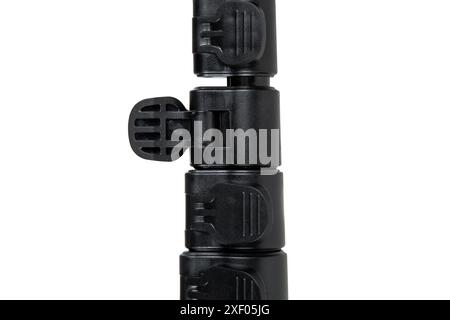 Black mini tripod for compact camera isolated on white background. Stock Photo