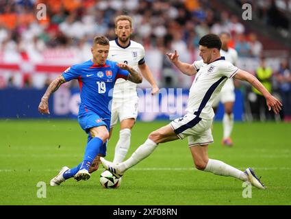 England's Declan Rice (right) and Slovakia's Matus Bero battle for the ...