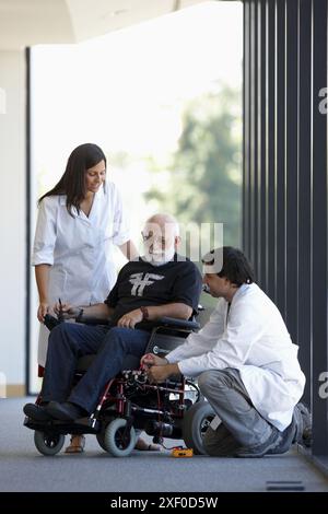 Health and Quality of life Unit researchers developing a control system for intelligent power wheelchair, FIK technology research program for aged and Stock Photo