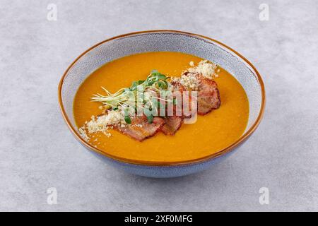 Red lentil soup puree on stone table. Top view. Stock Photo