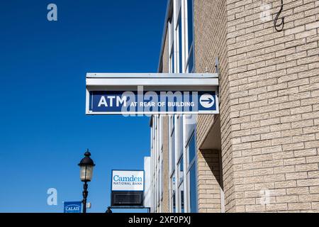 Directional sign to ATM at rear of building at Camden National Bank in downtown Calais, Maine, USA Stock Photo