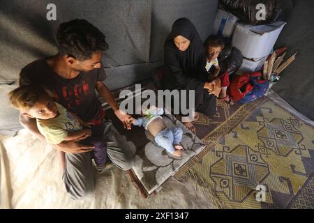 Noura Abu Al-Saud, a displaced Palestinian, lives in a tent inside a ...
