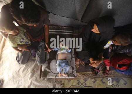 Noura Abu Al-Saud, a displaced Palestinian, lives in a tent inside a ...