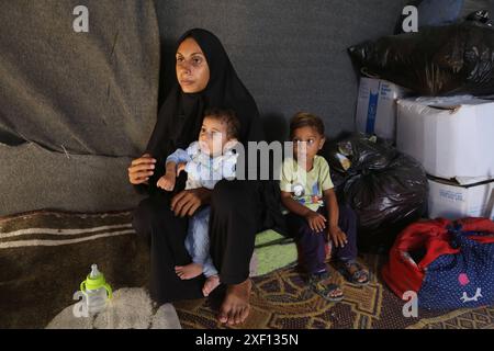 Noura Abu Al-Saud, a displaced Palestinian, lives in a tent inside a ...