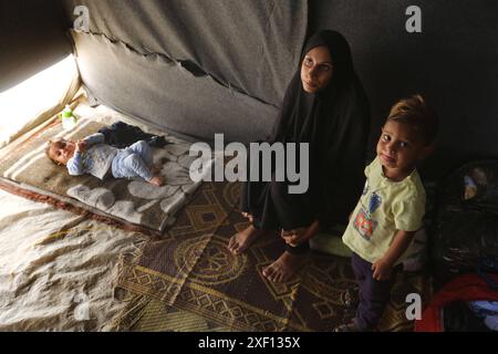 Noura Abu Al-Saud, a displaced Palestinian, lives in a tent inside a ...