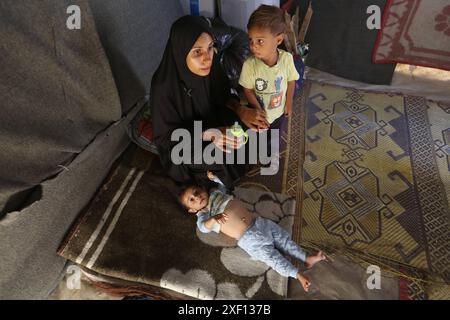 Noura Abu Al-Saud, a displaced Palestinian, lives in a tent inside a ...