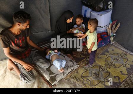Noura Abu Al-Saud, a displaced Palestinian, lives in a tent inside a ...
