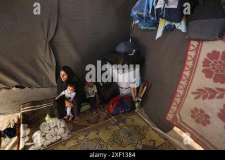 Noura Abu Al-Saud, a displaced Palestinian, lives in a tent inside a ...