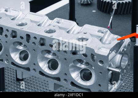The Coordinate Measuring CMM Machine. Repair motor block of cylinders, operator inspection dimension aluminium automotive cylinder block Stock Photo