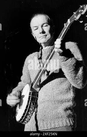 Folk singer Pete Seeger preforms at Anti-Vietnam War  Moratorium at the University of Missouri-Kansas City Kansas City Missouri in October 1969. Seeger was 50 years old a folk singer and social activist Stock Photo