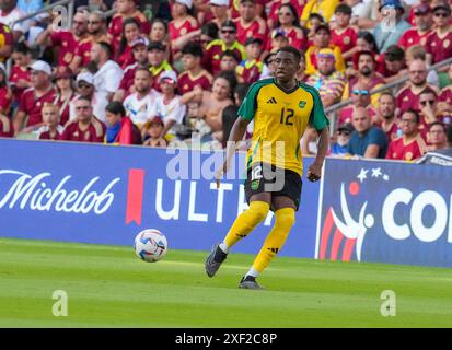 Austin, United States. 30th June, 2024. Jamaica's WESLEY NATHAN HARDING (12) looks to pass the ball during first half action in the Group B final stage match of the CONMEBOL Copa America 2024 at Austin's Q2 Stadium on June 30, 2024. Venezuela advanced out of the group stage with a 3-0 victory over Jamaica Credit: Bob Daemmrich/Alamy Live News Stock Photo