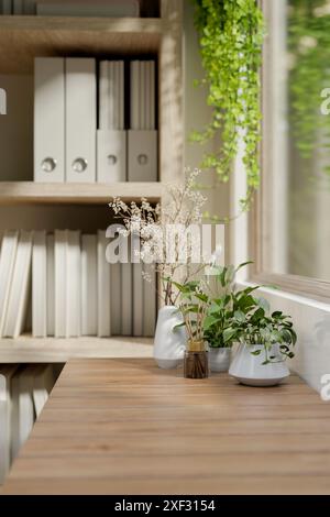 A close-up image of a reed diffuser, decor plants, and a copy space on wooden table by the bookshelf against the window in a minimalist bright room. 3 Stock Photo
