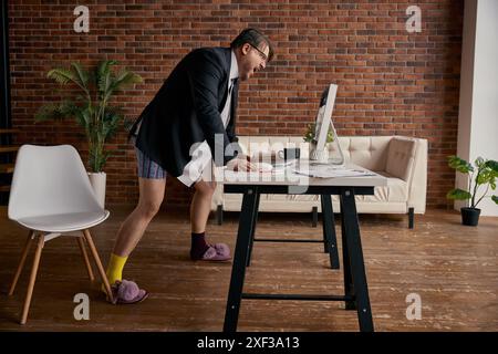Angry businessman screaming on computer having online meeting at home office Stock Photo