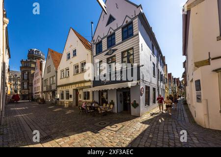 In the background, the dome of Bremen's University of the Arts in the Schnoor district. Hinter der Balge, Bremen, Bremen, Bremen, Germany Stock Photo