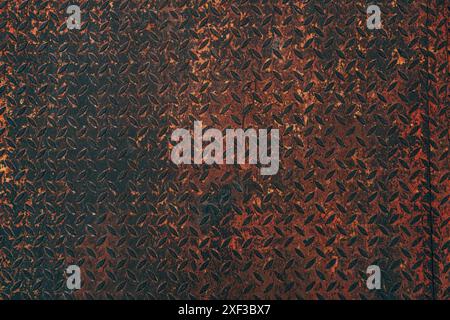 Rusty corroded steel metal surface with anti slip pattern as background and texture, top view Stock Photo