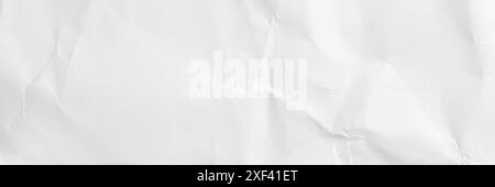 White sheet of crumpled folded paper with intricate textures and soft wrinkles. Abstract light background for banner design Stock Photo