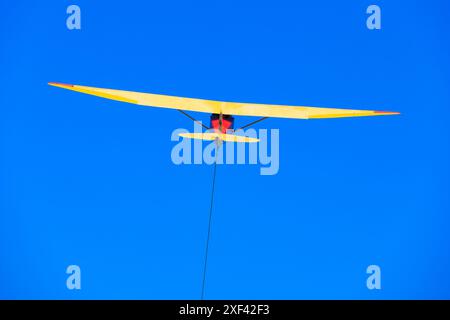 Vintage Slingsby T21 training glider taking off on a winch launch at Buckminster Gliding Club, Saltby, Lincolnshire, England Stock Photo