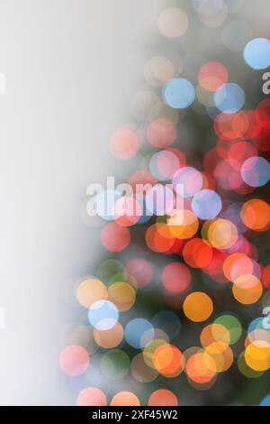 Christmas tree illuminated with garlands of lights, defocused image, bokeh Stock Photo