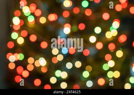 Christmas tree illuminated with garlands of lights, defocused image, bokeh Stock Photo